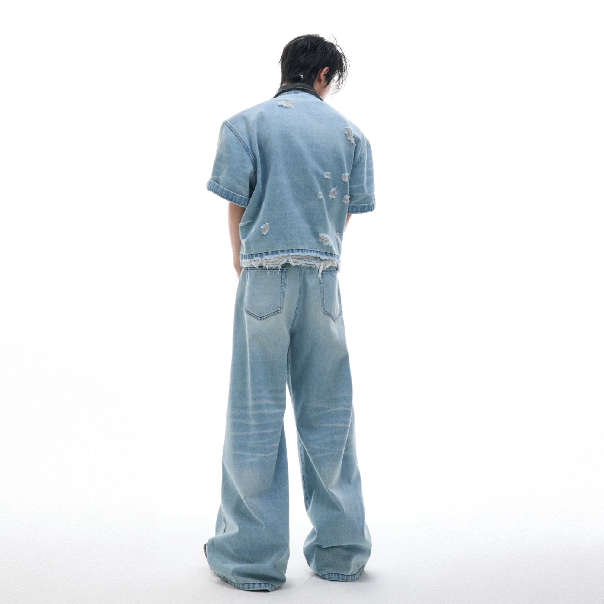 High resolution shot of the distressed denim fabric and washing texture