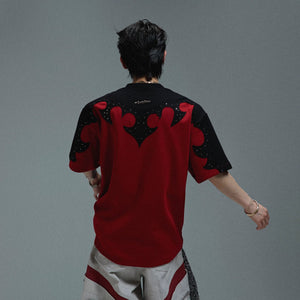 Close-up of 3D splicing and rhinestone details on a streetwear tee