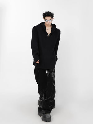 Streetwear style outfit featuring an oversized knit hoodie and baggy pants