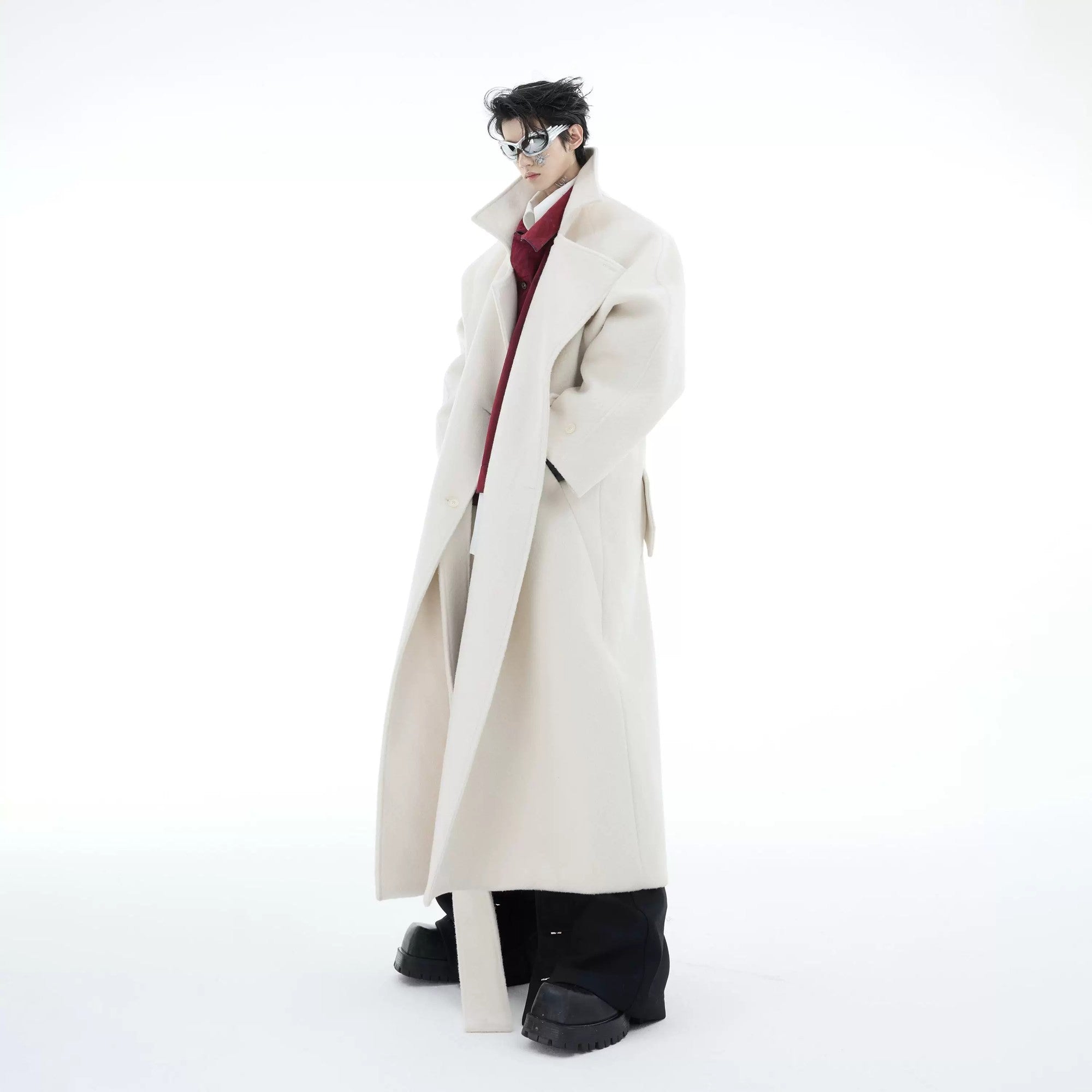 Model wearing the oversized dropped shoulder wool coat in a city setting