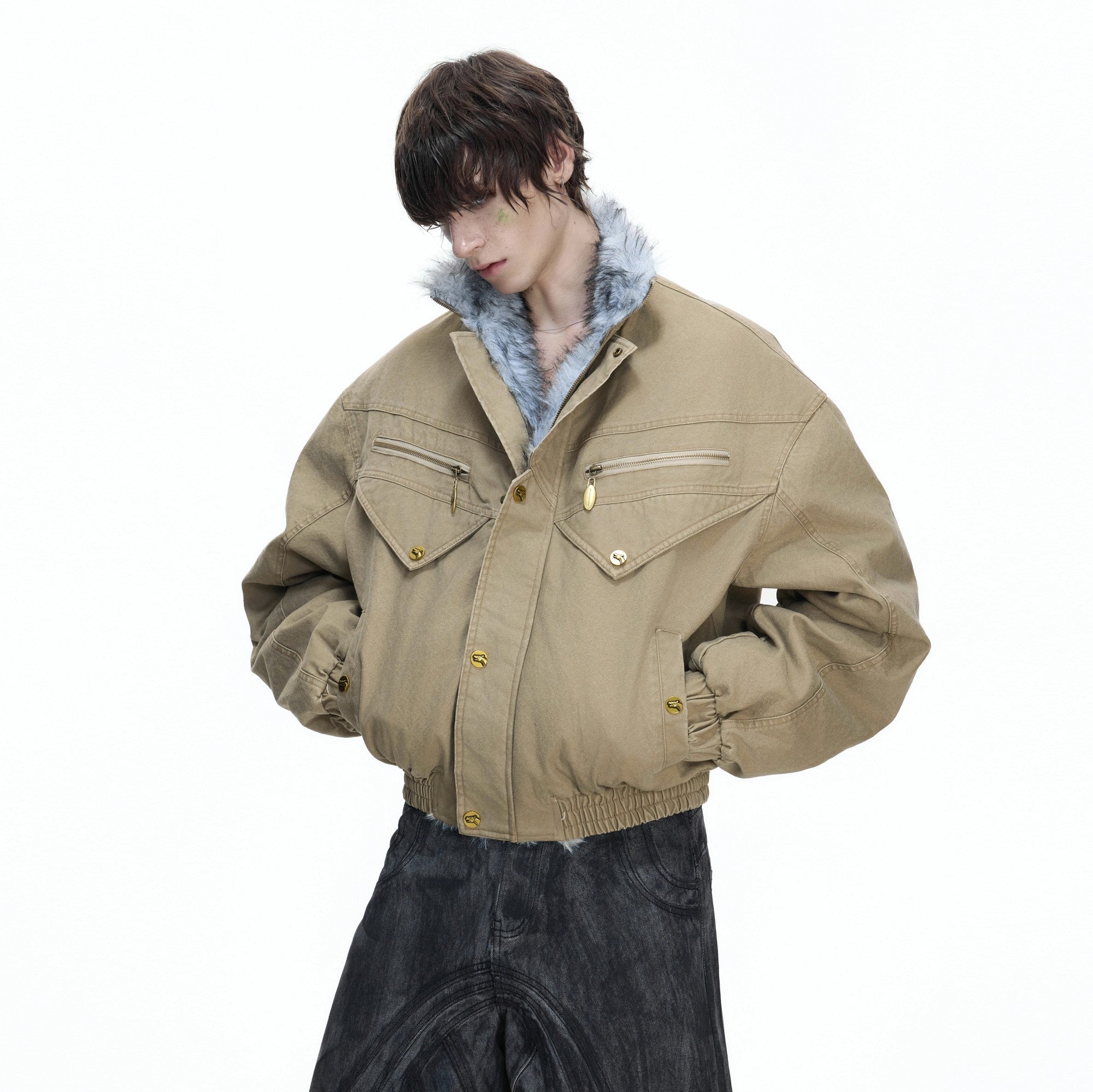 Rear view of black oversized washed canvas jacket showing splicing details