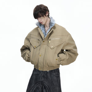 Rear view of black oversized washed canvas jacket showing splicing details