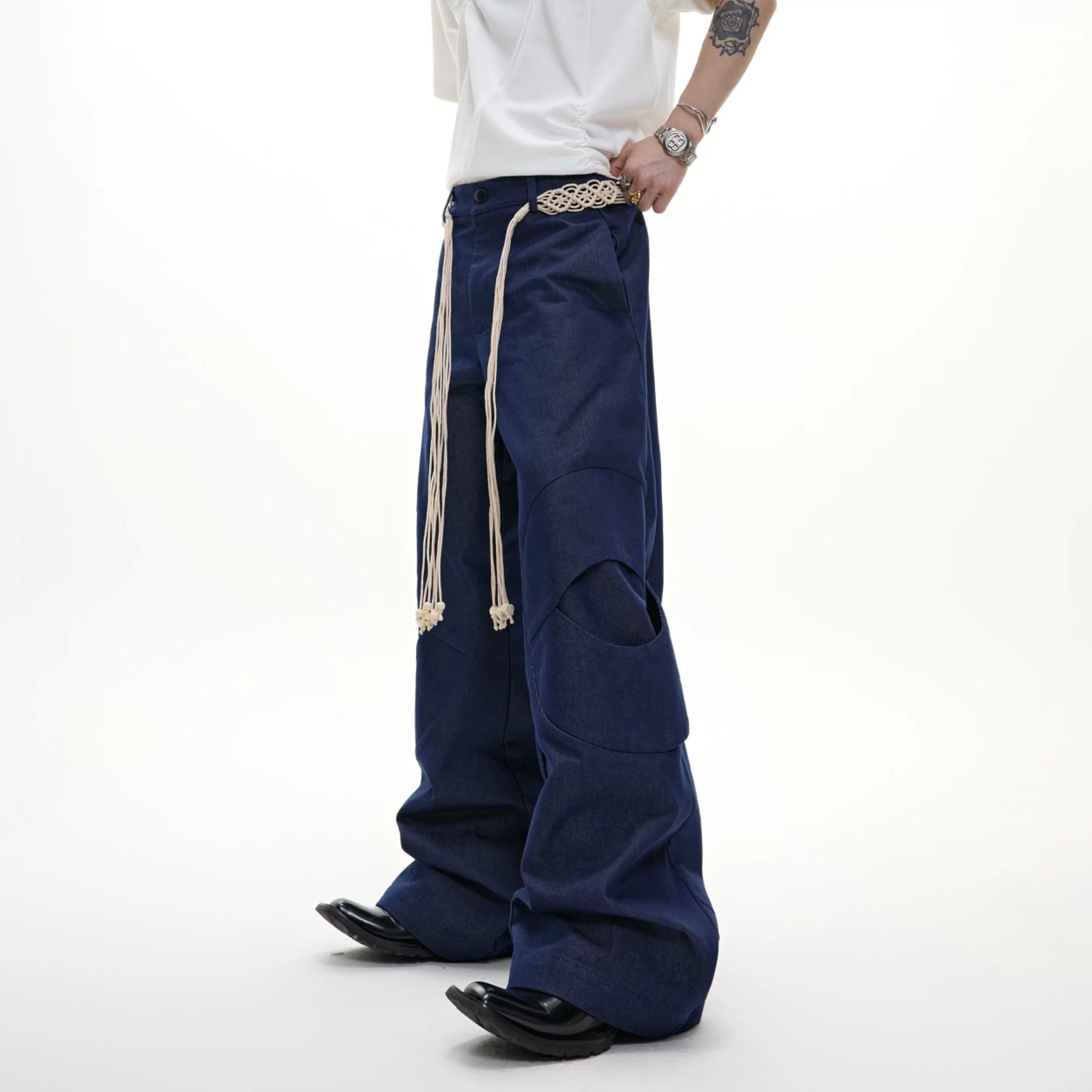 Front view of high waist deconstructed straight leg streetwear pants in gray