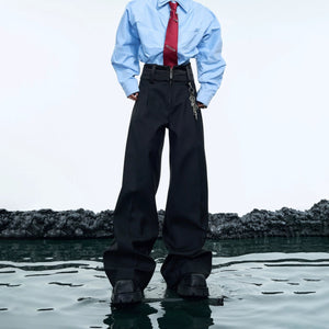 Front view of black high-waisted deconstructed flare streetwear trousers