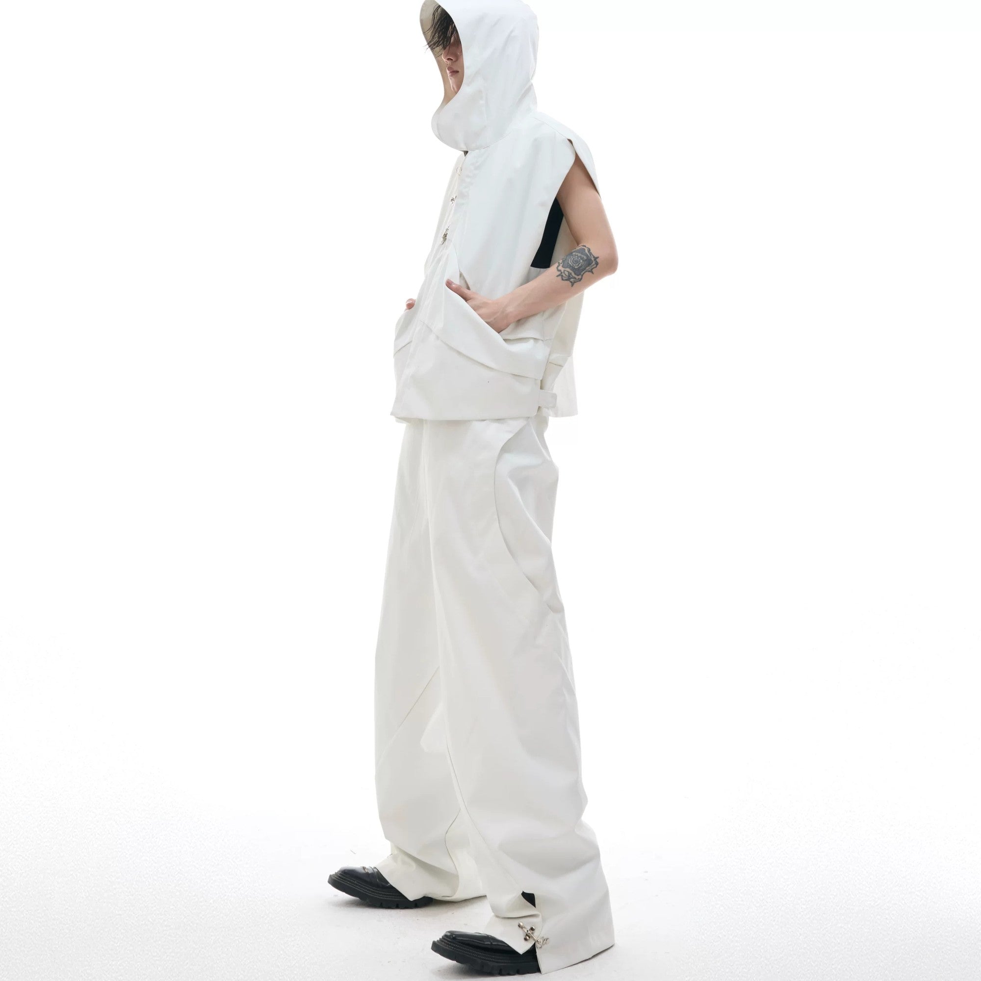 Detail of the split pants hem with metal hardware accents