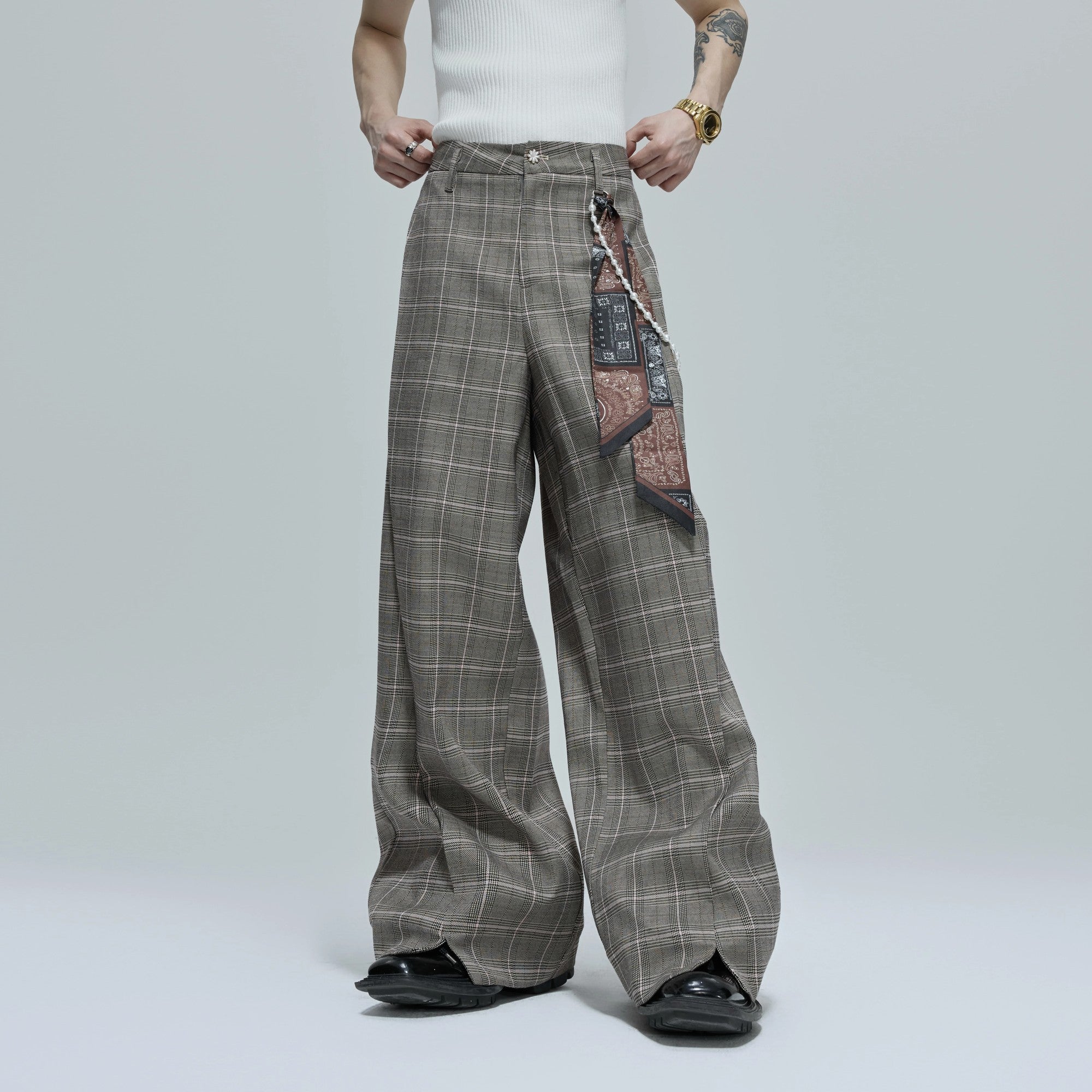 Model wearing loose fit houndstooth streetwear pants
