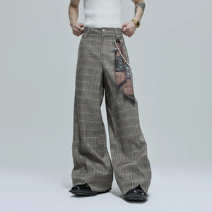 Model wearing loose fit houndstooth streetwear pants