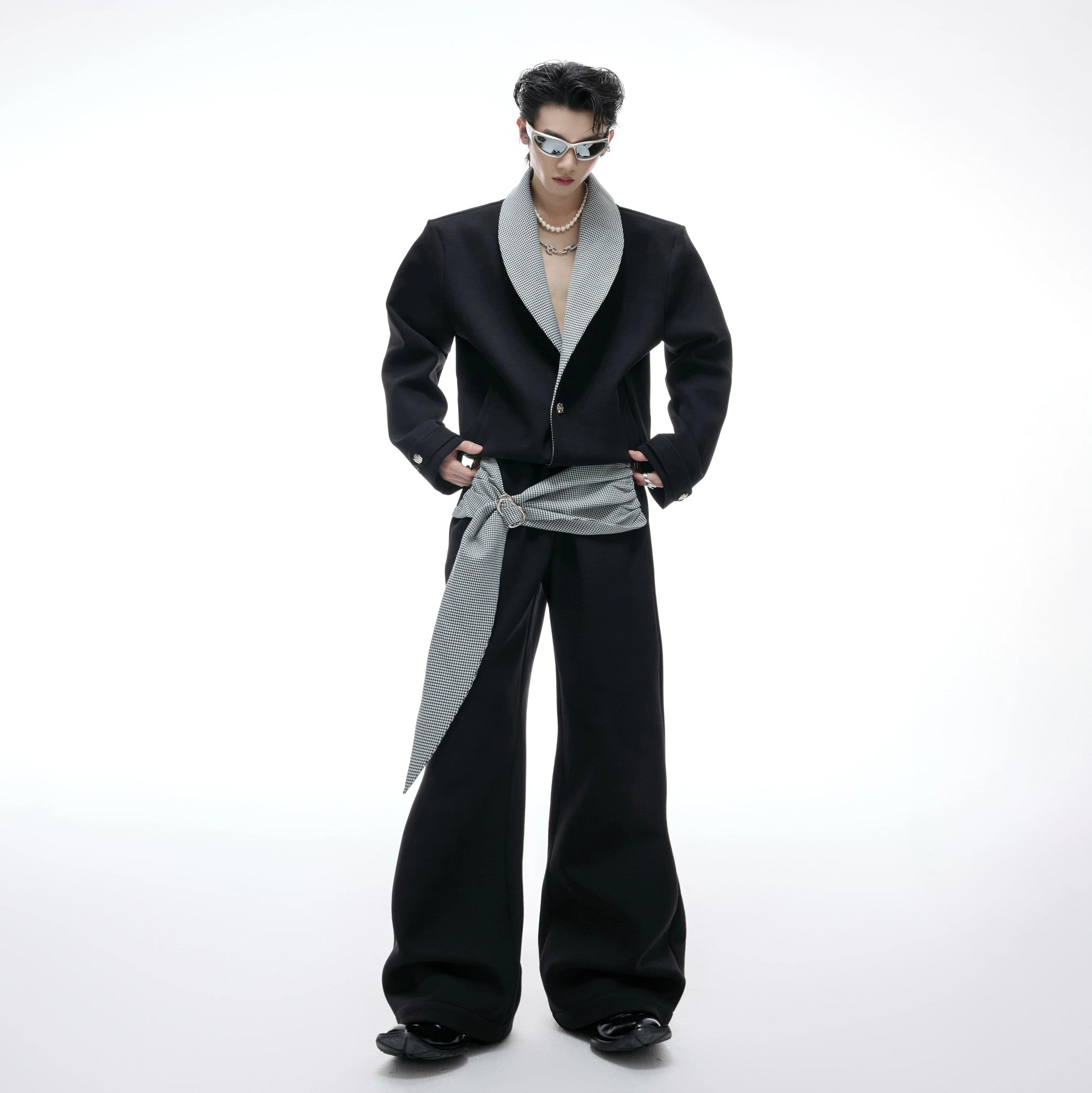 Model wearing the oversized houndstooth co-ord set in a street setting