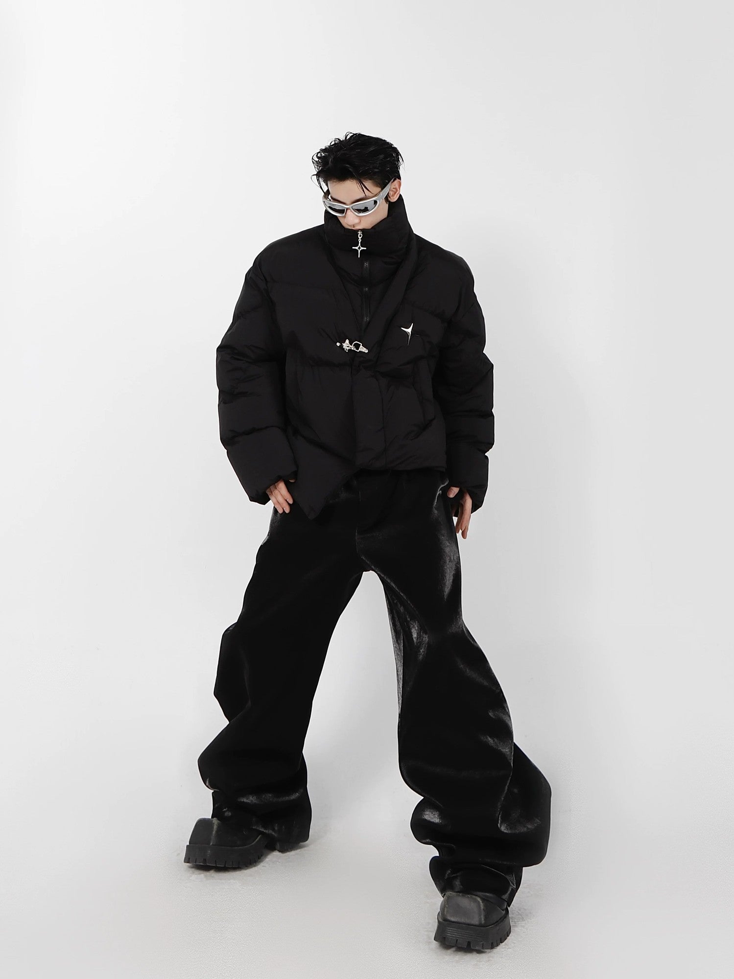 Model wearing loose fit cropped puffer jacket in urban setting