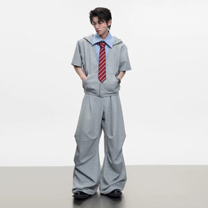 Front view of grey deconstructed short sleeve hoodie and shorts set