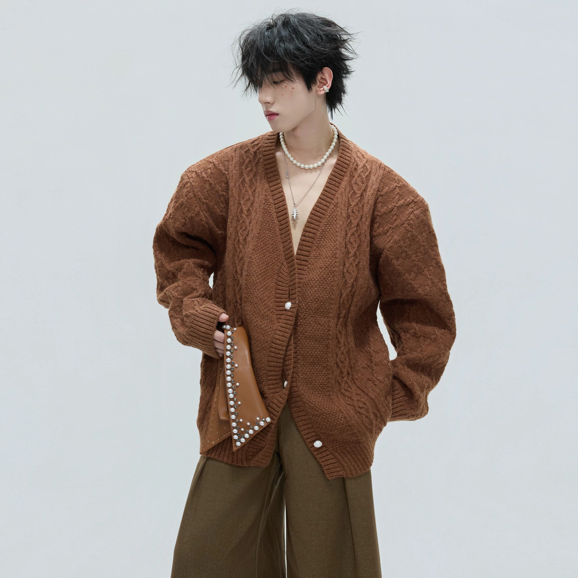 Close up shot of hand-stitched pearls on a vintage style collar.