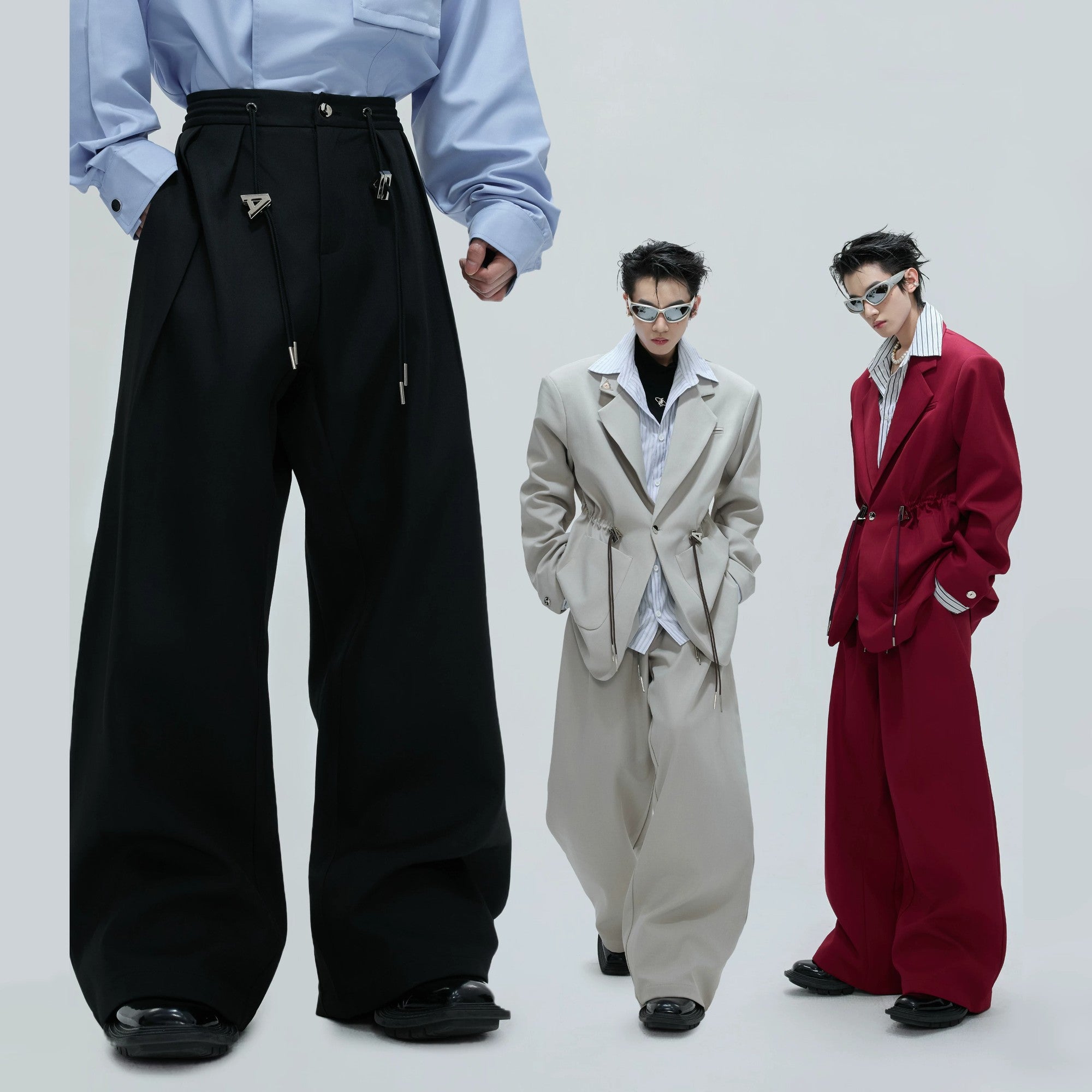 Red version of the deconstructed suit set styled for a streetwear look.