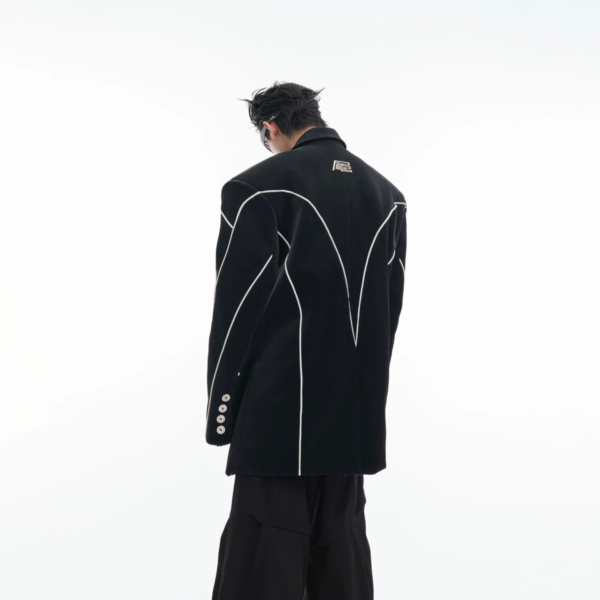 Close up of structured padded shoulders on an avant-garde leather blazer