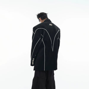 Close up of structured padded shoulders on an avant-garde leather blazer