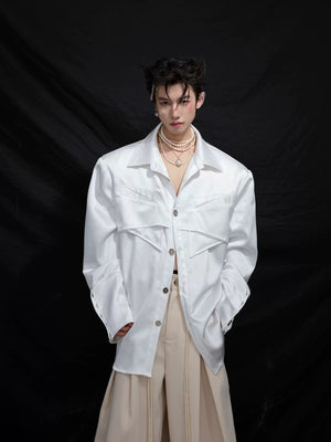 Close-up of the detachable shoulder pads and pleated design details.