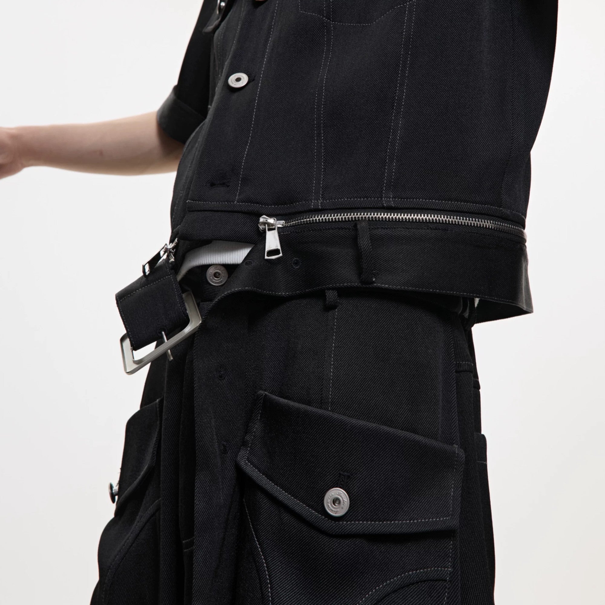 Detailed view of contrast stitching on luxury wide-leg denim pants