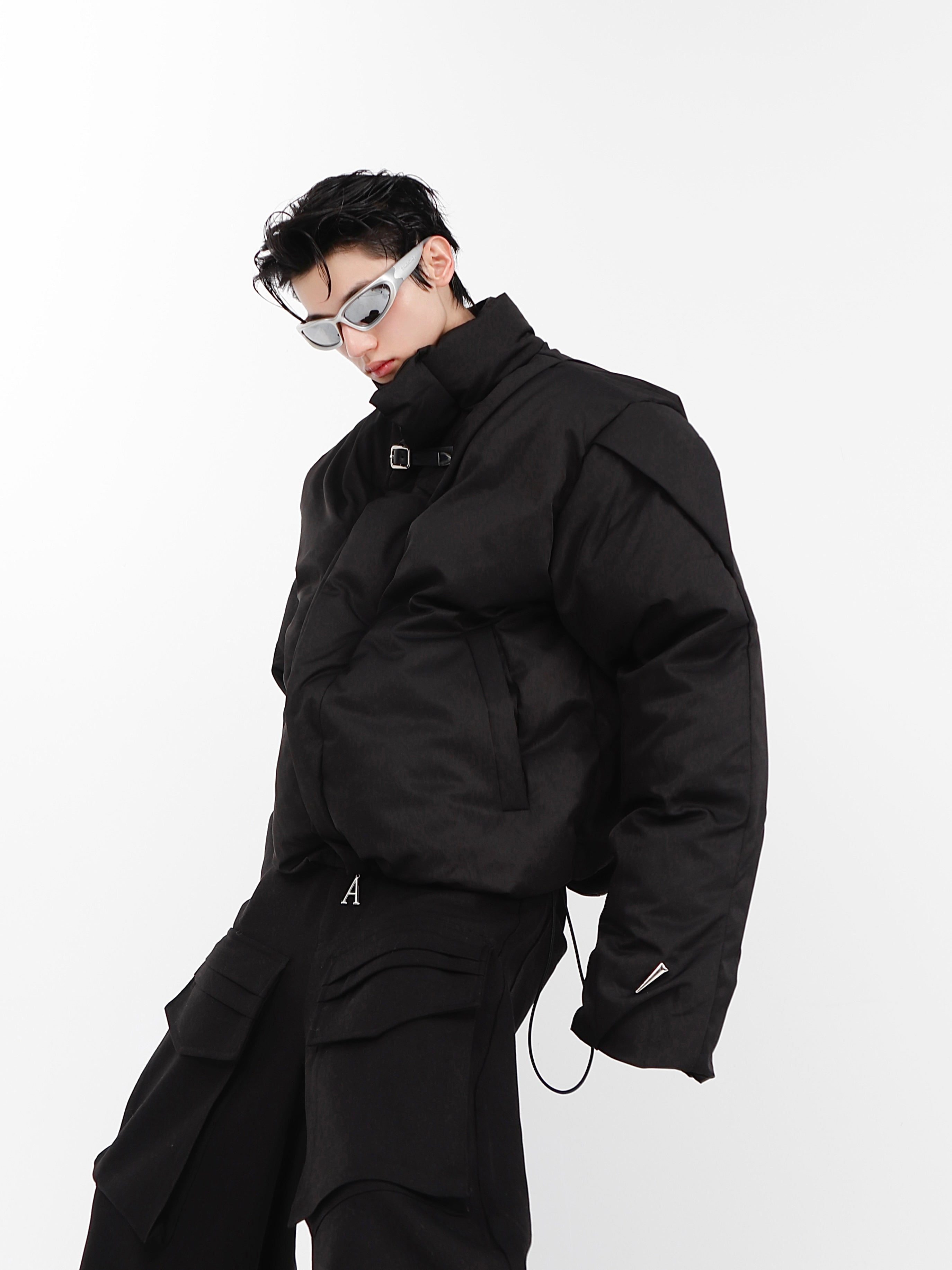 Close-up detail of avant-garde jacket showing high-quality metal zipper and structured collar