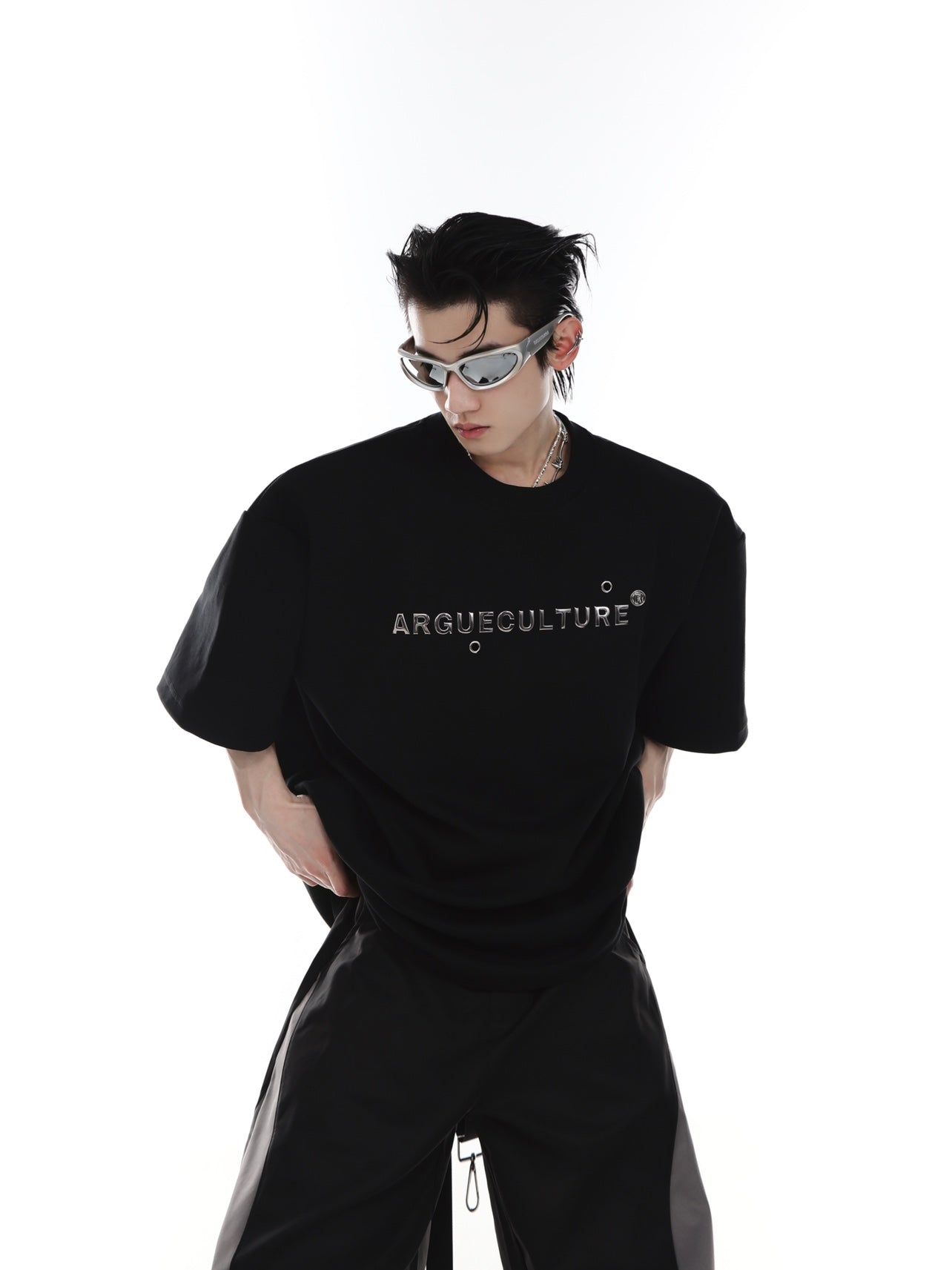 Back view of the architectural silhouette tee featuring bold graphic print and loose-leaf details