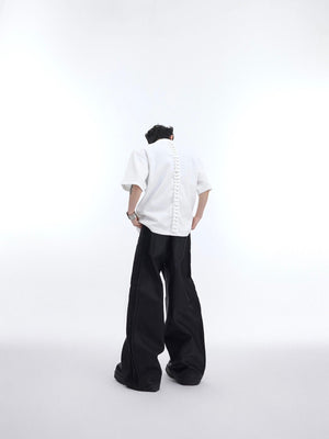 Fashion-forward asymmetric t-shirt with bold round-hole cutouts and oversized fit