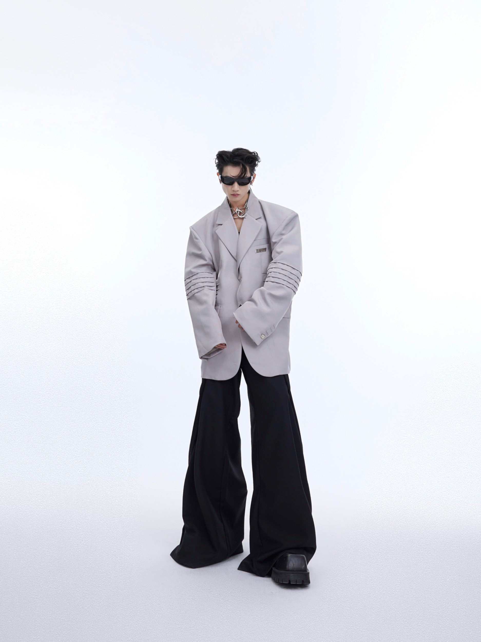 Back view showcasing the unconventional asymmetrical design of this contemporary blazer jacket