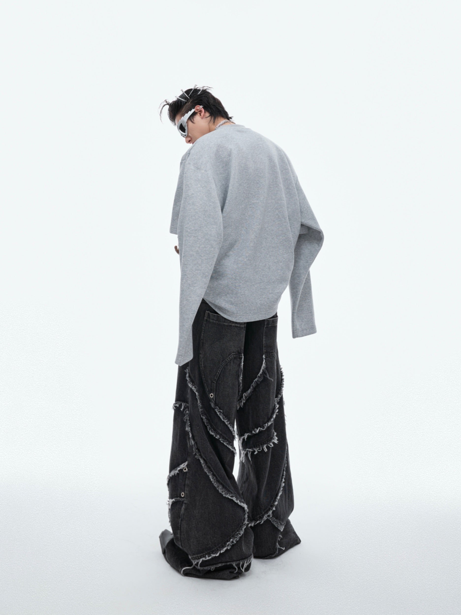 Detail shot showing innovative layered sleeve design combining short and long sleeve elements