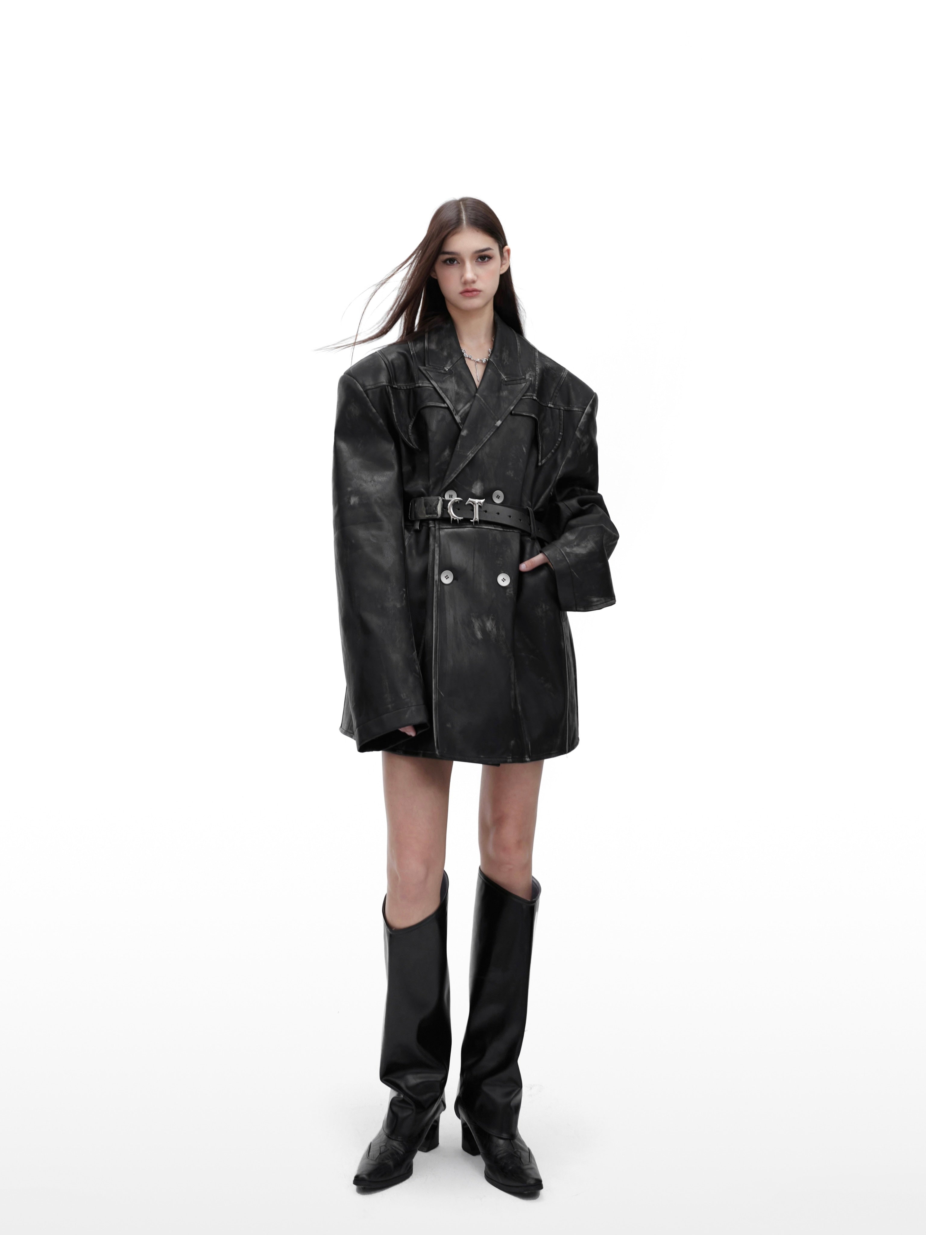 Side angle showing asymmetric panels and hand-distressed finish on this unique oversized shoulder jacket