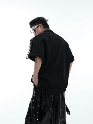 Front view of deconstructed Chinese-inspired polo tee showing loose fit and asymmetrical paneling with streetwear aesthetic
