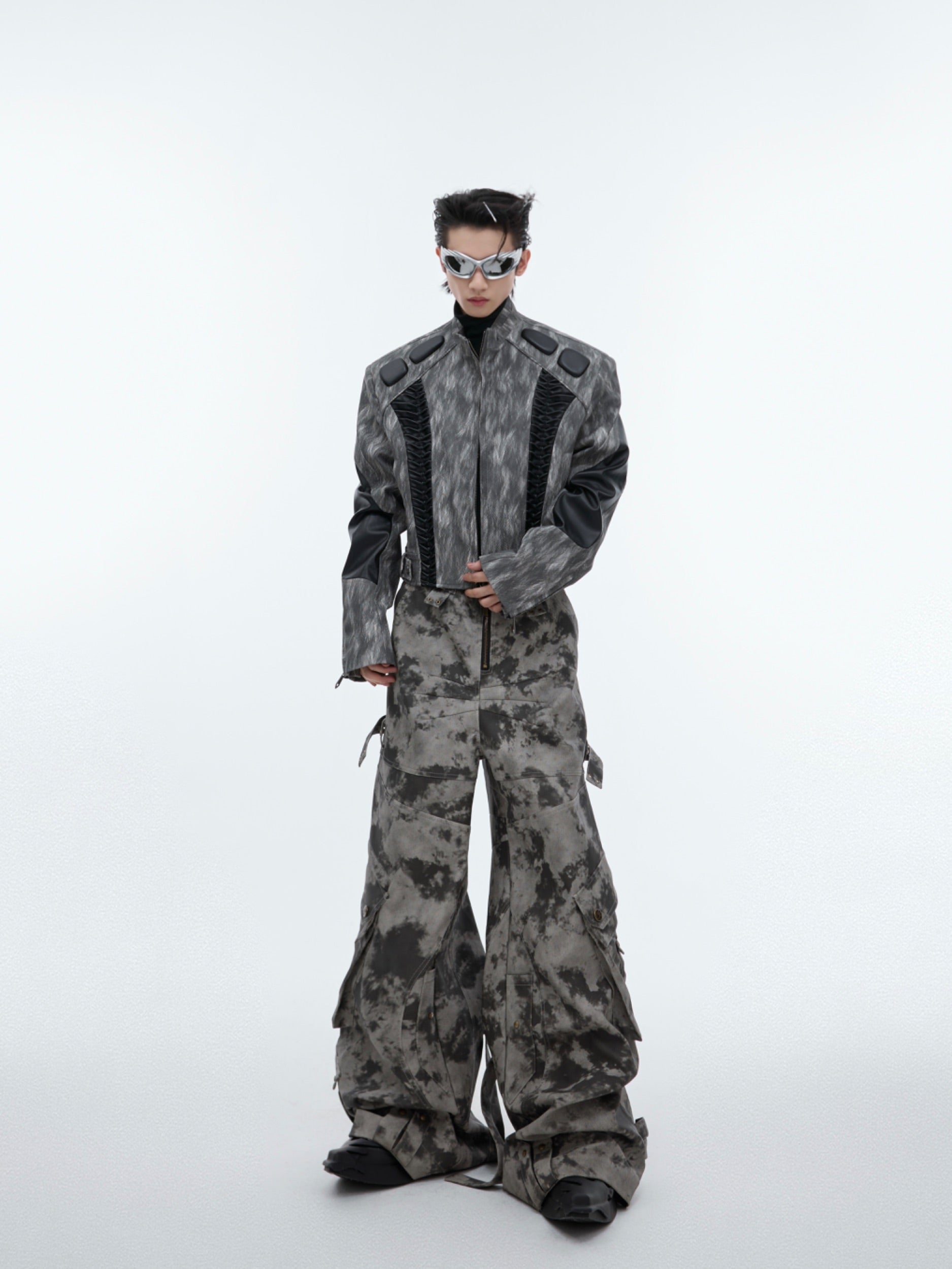 Authentic distressed finish on vintage leather cargo pants showing high-quality craftsmanship and texture