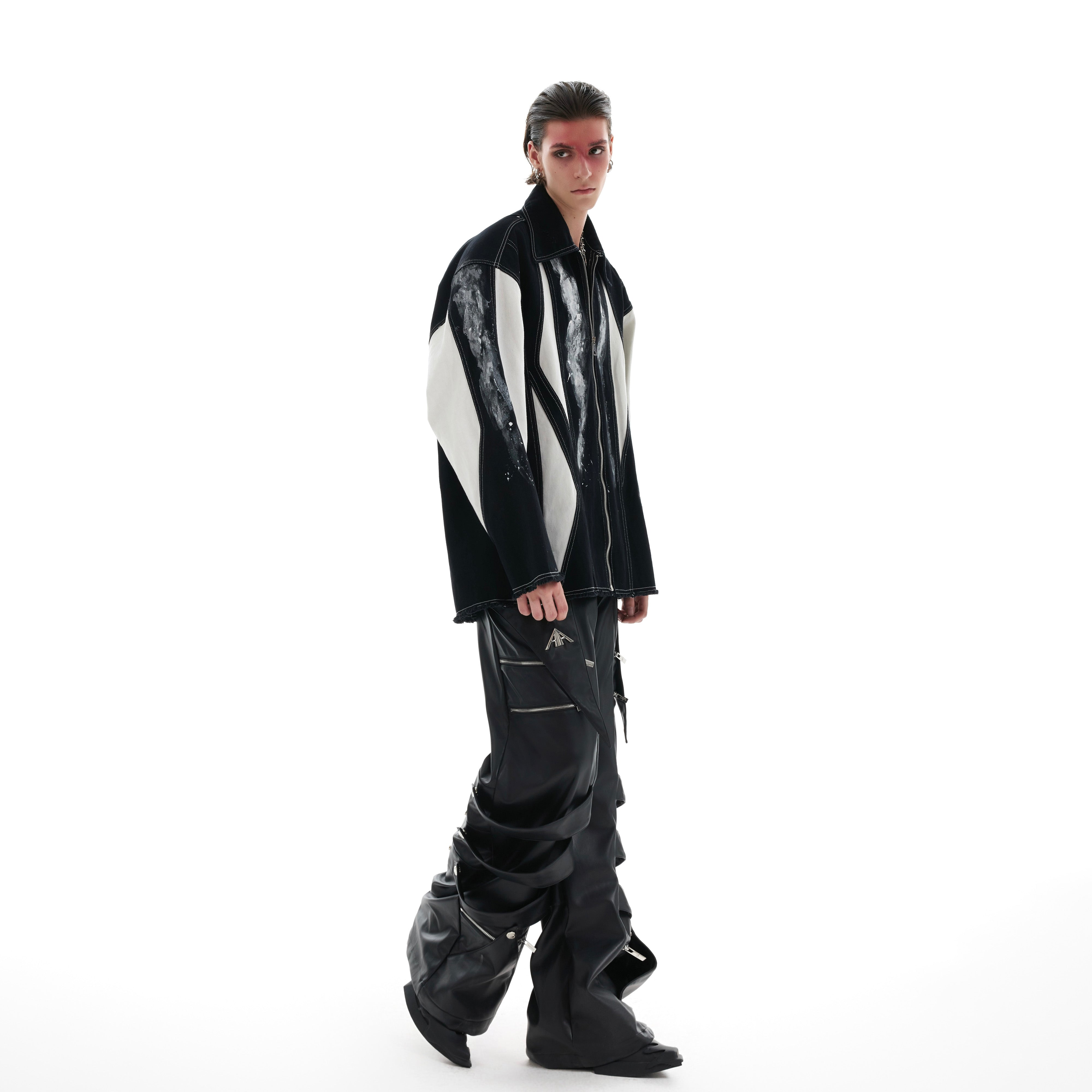 Detailed view of sleeve construction and color-block pattern on statement oversized shirt-jacket