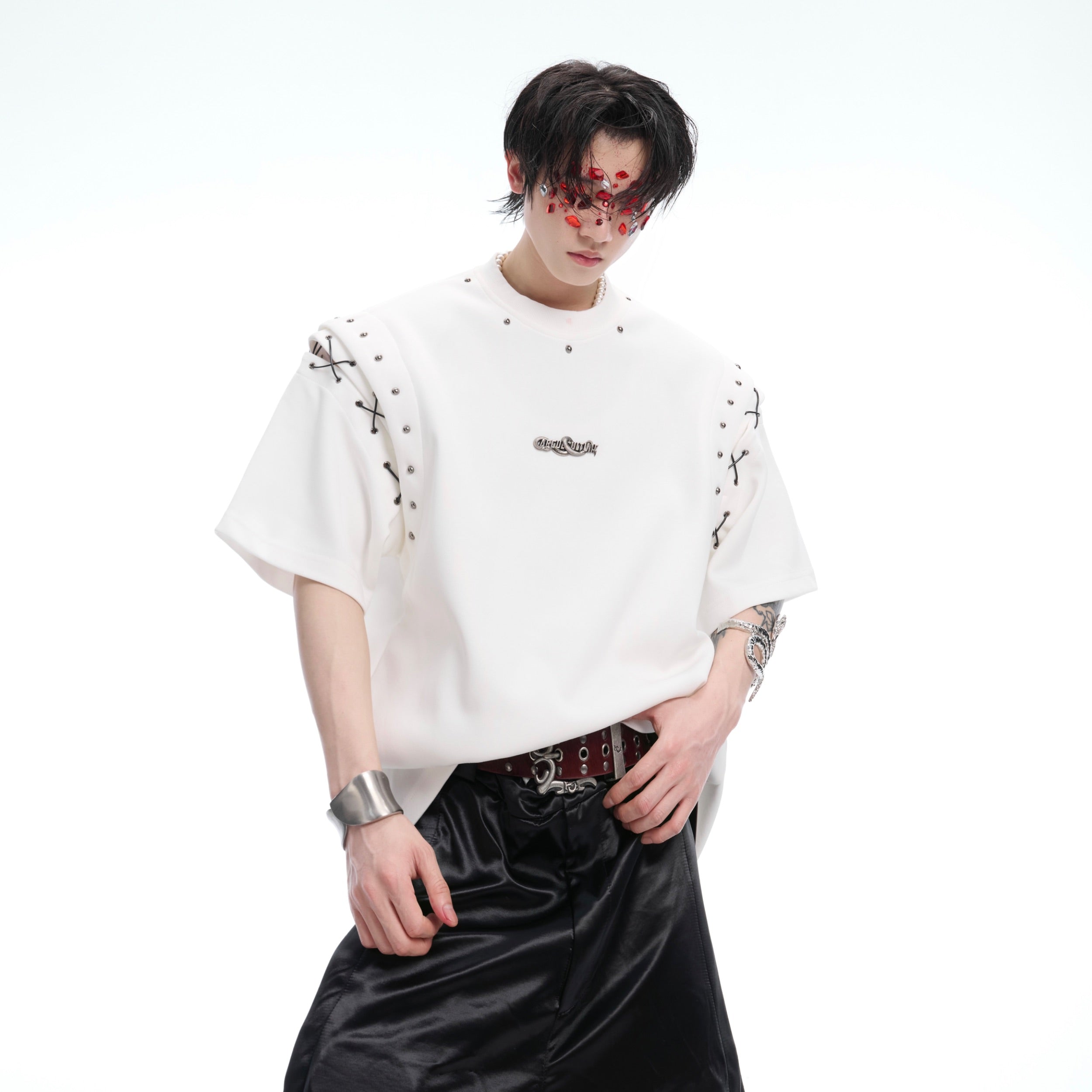 Side view of architectural crop top showing unique 3D silhouette and urban streetwear style