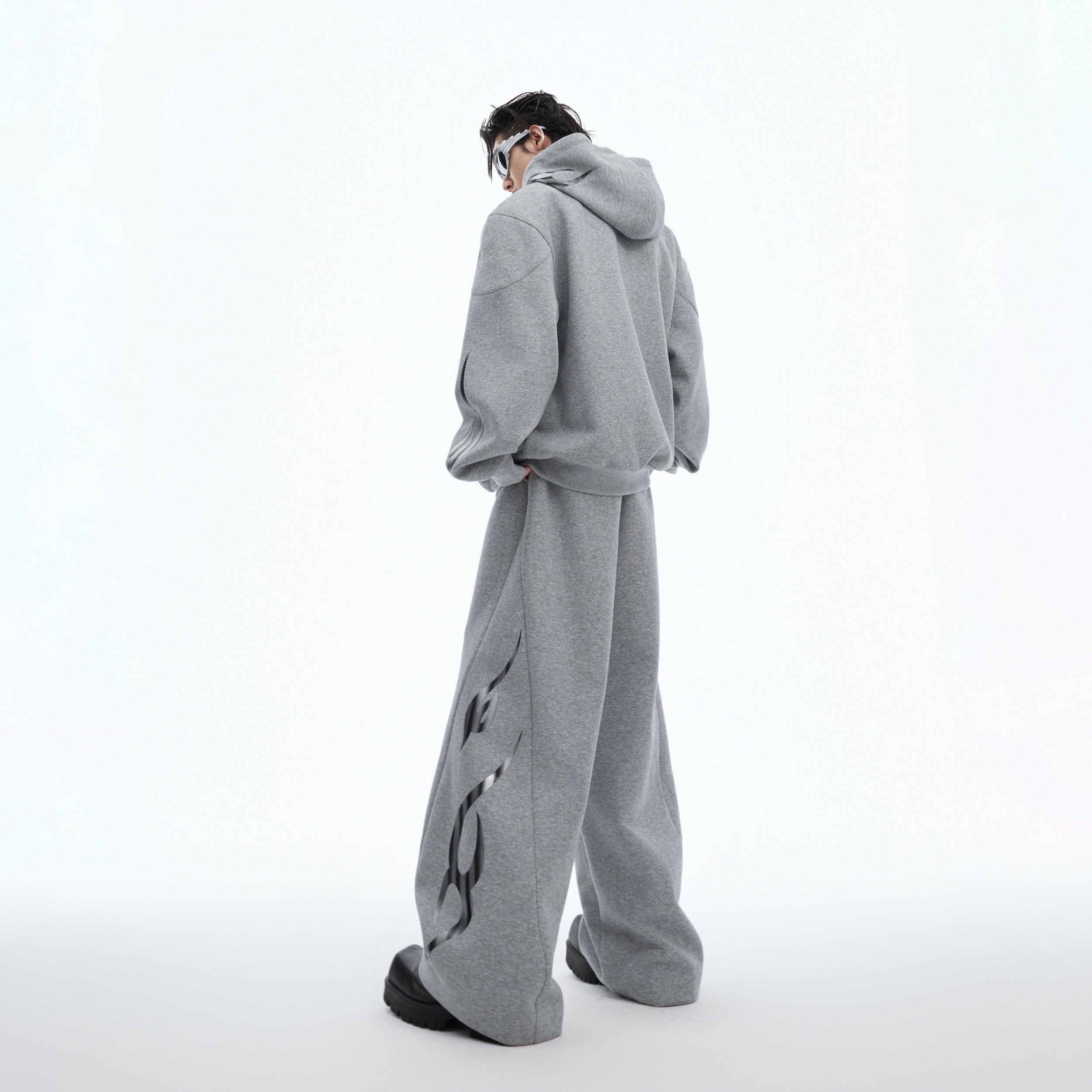 Back view of heavy cotton hoodie featuring bold flame print and relaxed oversized fit for urban style