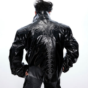 Close-up of premium quality spiked embellishments and embossed leather texture on streetwear coat