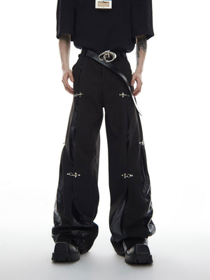 Detailed shot showing the metal hardware and deconstructed elements on streetwear cargo trousers