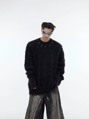 Front view of oversized unisex chunky knit sweater featuring stylish metal buttons and plush fabric texture