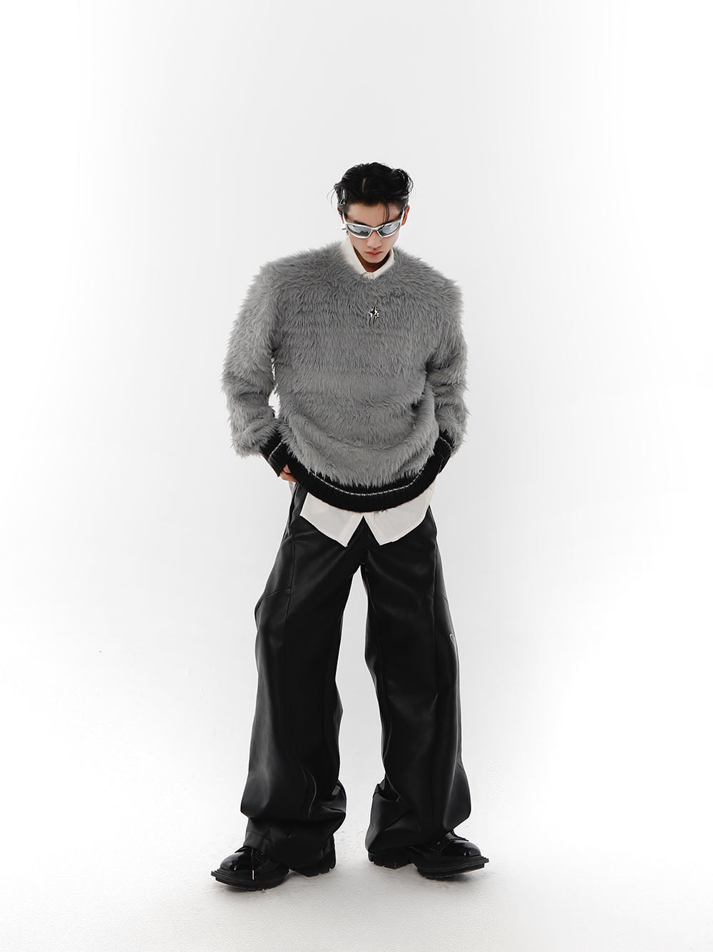 Back view of avant-garde chunky knitwear with unique design details and oversized fit