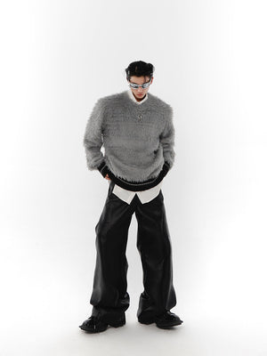 Back view of avant-garde chunky knitwear with unique design details and oversized fit
