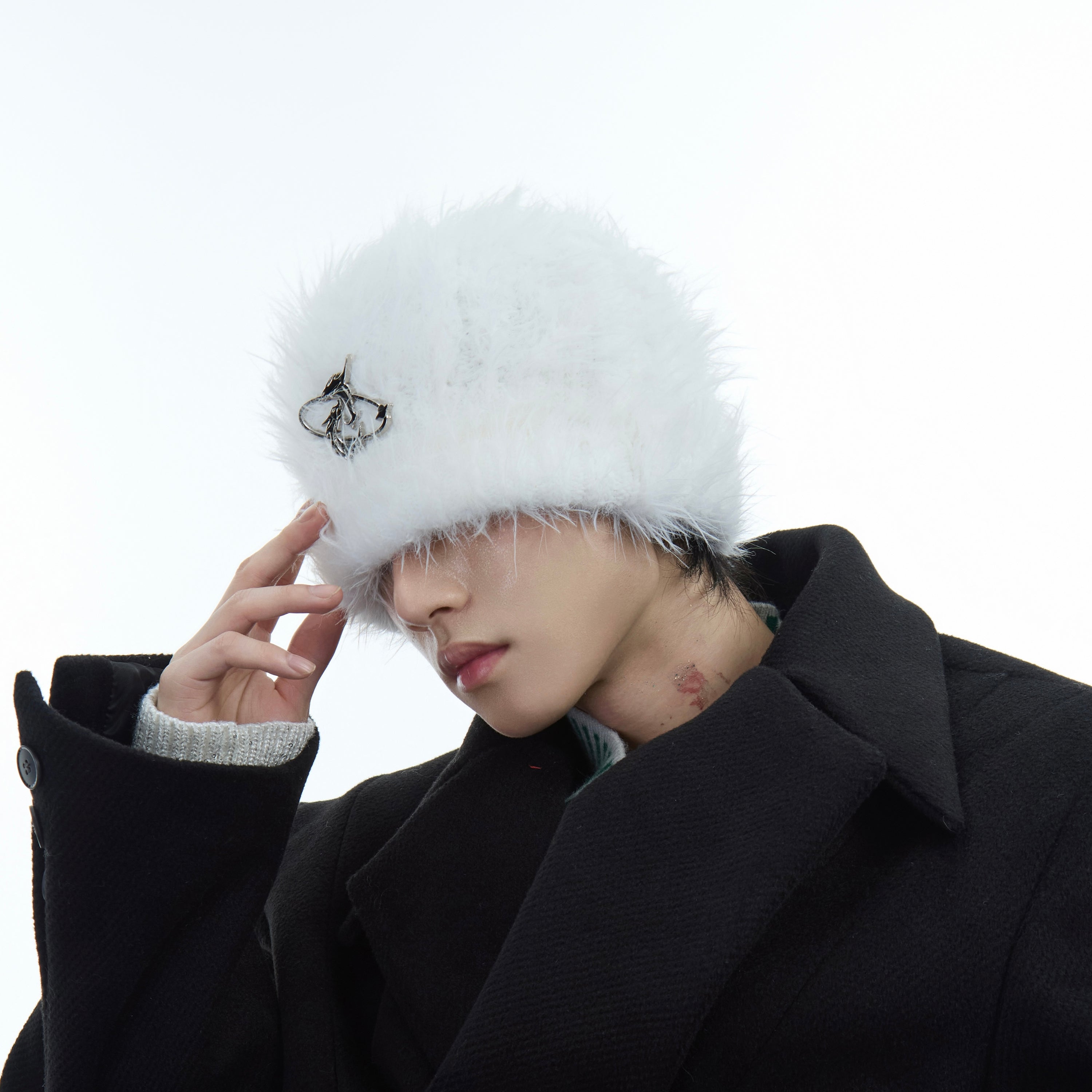 Detailed close-up of the beanie's fluffy mohair texture and high-quality pearl embellishments