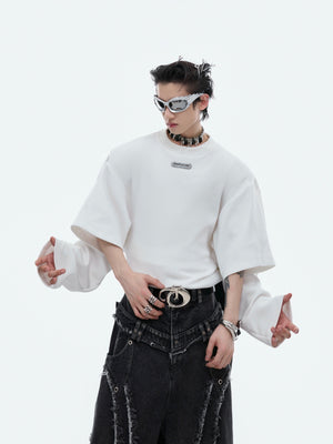 Side angle showing unique color-block design and innovative mock-two-piece construction in this unisex statement hoodie