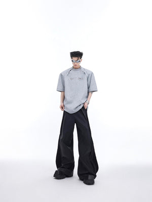 Layflat presentation of the graphic cutout tee showing full design with premium eco-conscious fabric texture