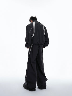Detail shot of color-block hoodie showing unique raw-edged detailing and avant-garde construction