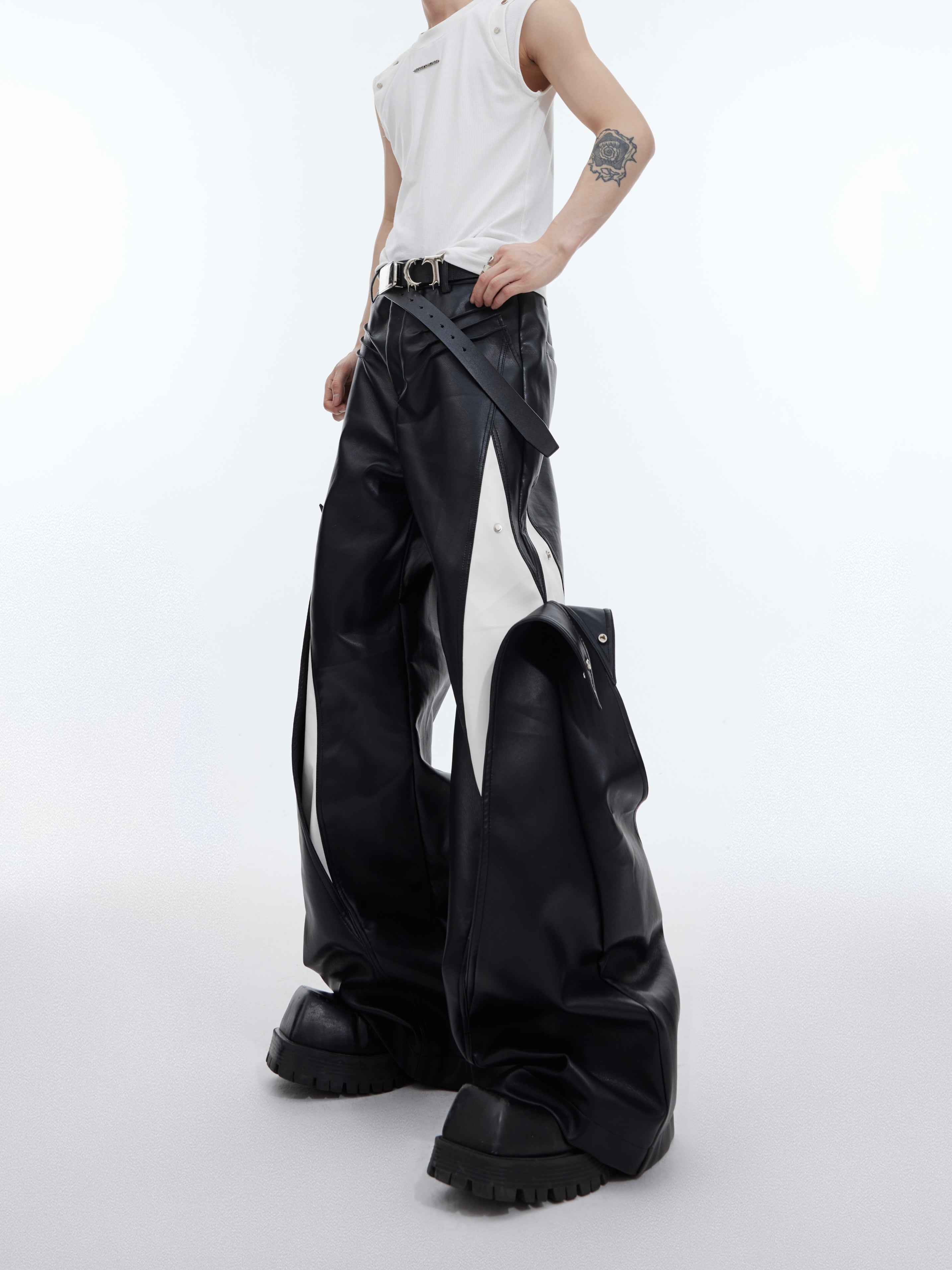 Close-up of the color-blocking details and premium construction of these edgy deconstructed pants