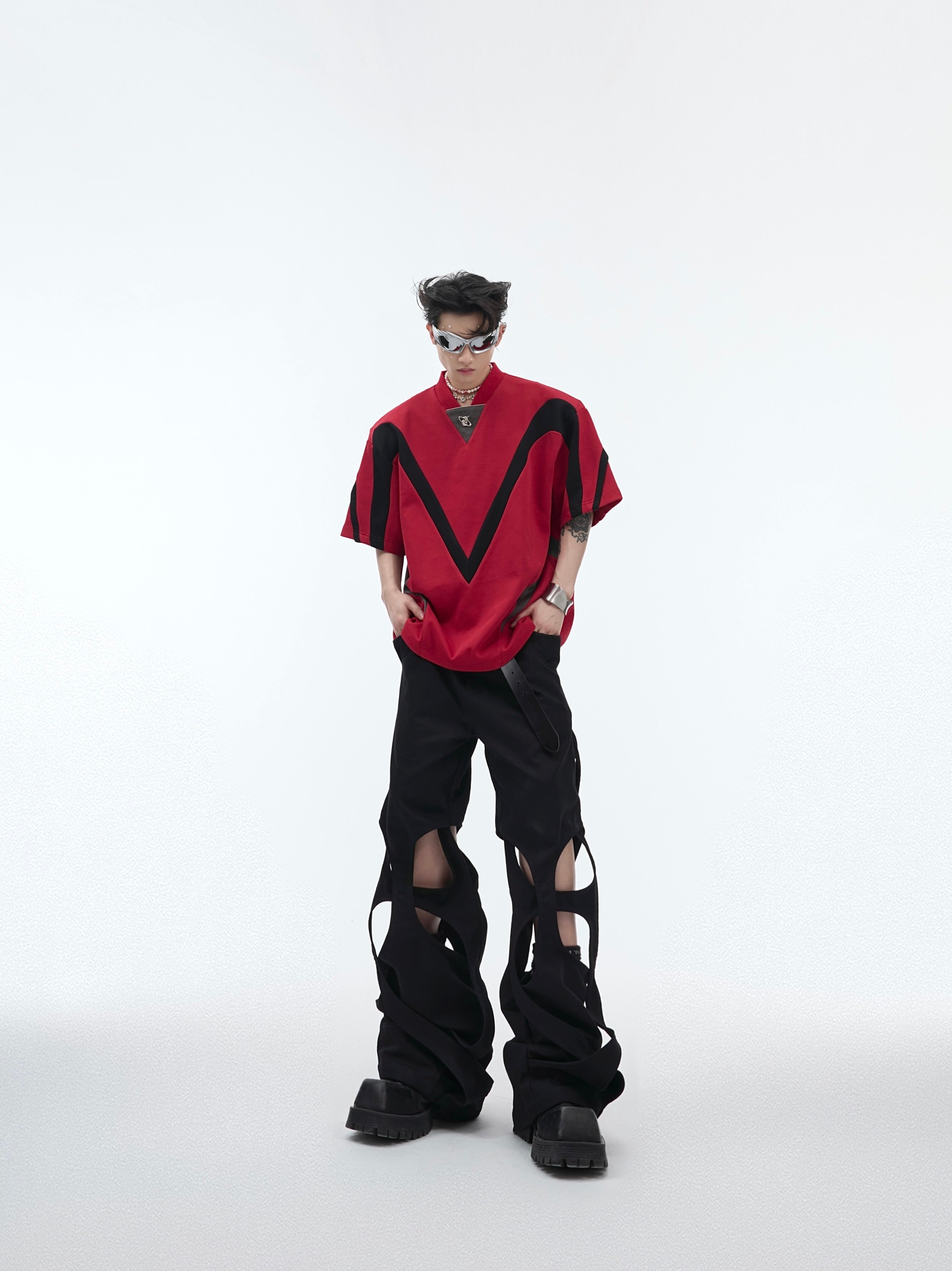 Back view of the deconstructed sleeveless top featuring minimalist color-block pattern for urban fashion
