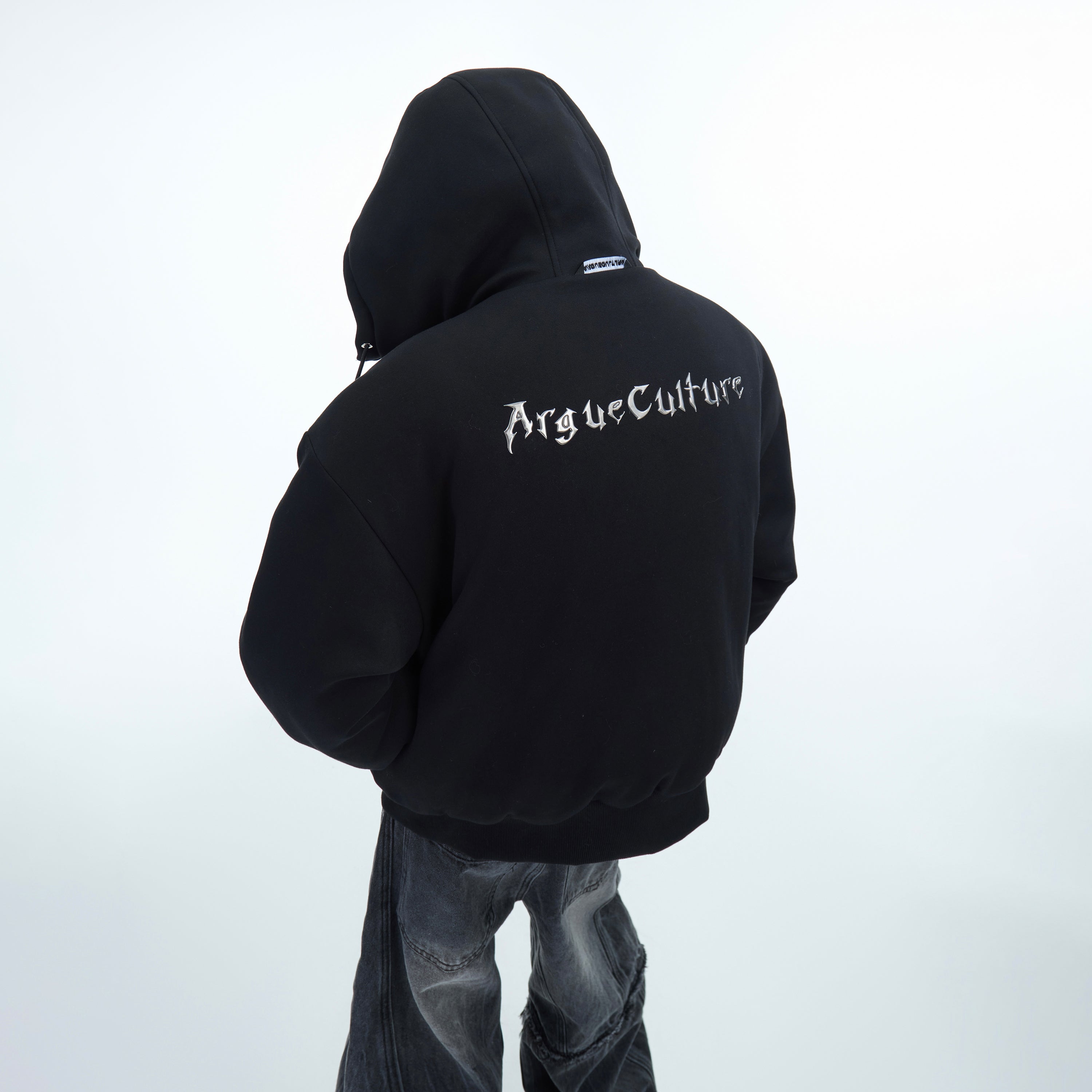 Close-up view of retro washed cotton jacket showcasing premium logo detailing and soft fabric texture