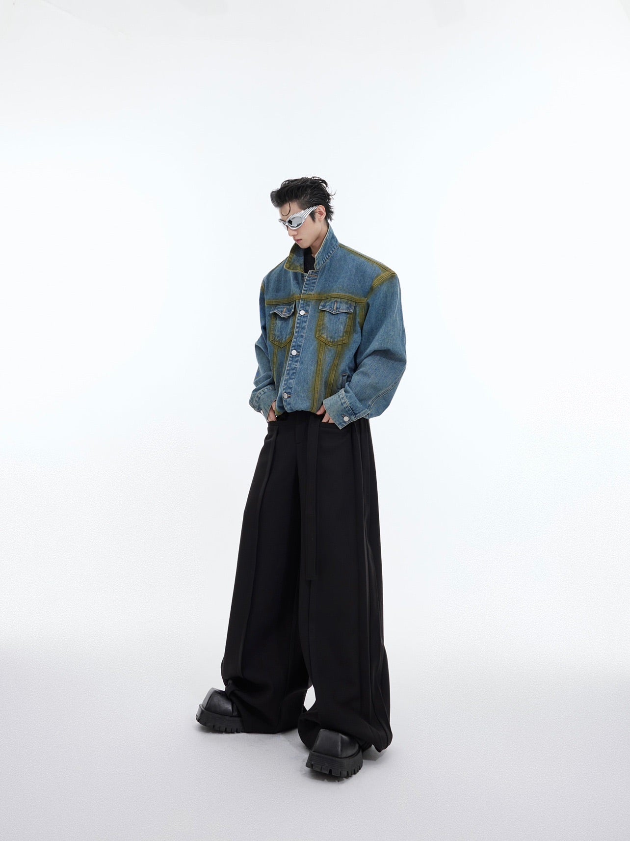 Close-up of artful distressing and premium stitching on this cropped fit vintage denim jacket