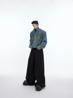 Close-up of artful distressing and premium stitching on this cropped fit vintage denim jacket