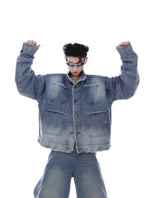 Cropped denim jacket with exaggerated front panel design and distressed details for urban streetwear look