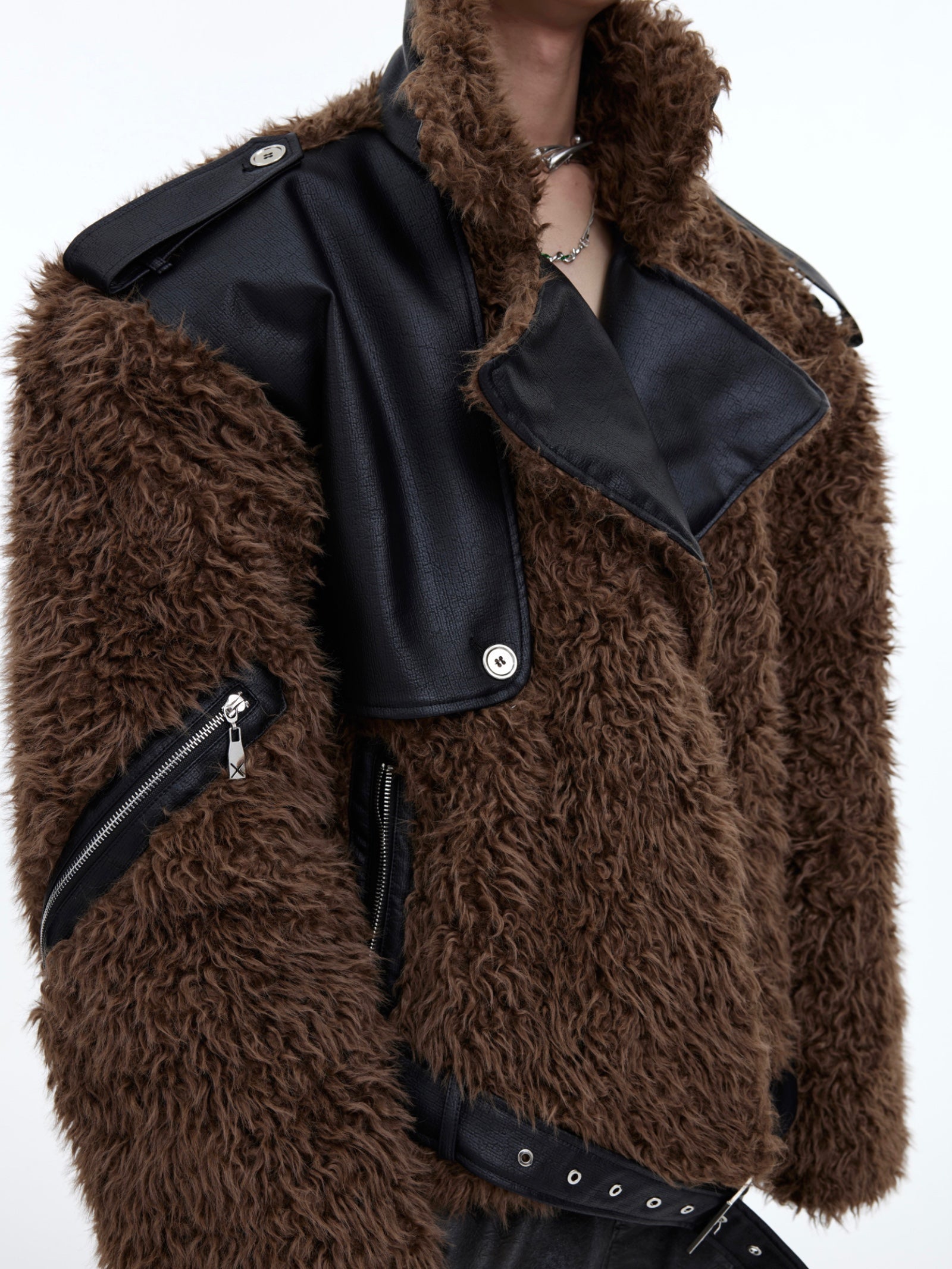 Back view of the deconstructed cropped jacket showing innovative streetwear design elements