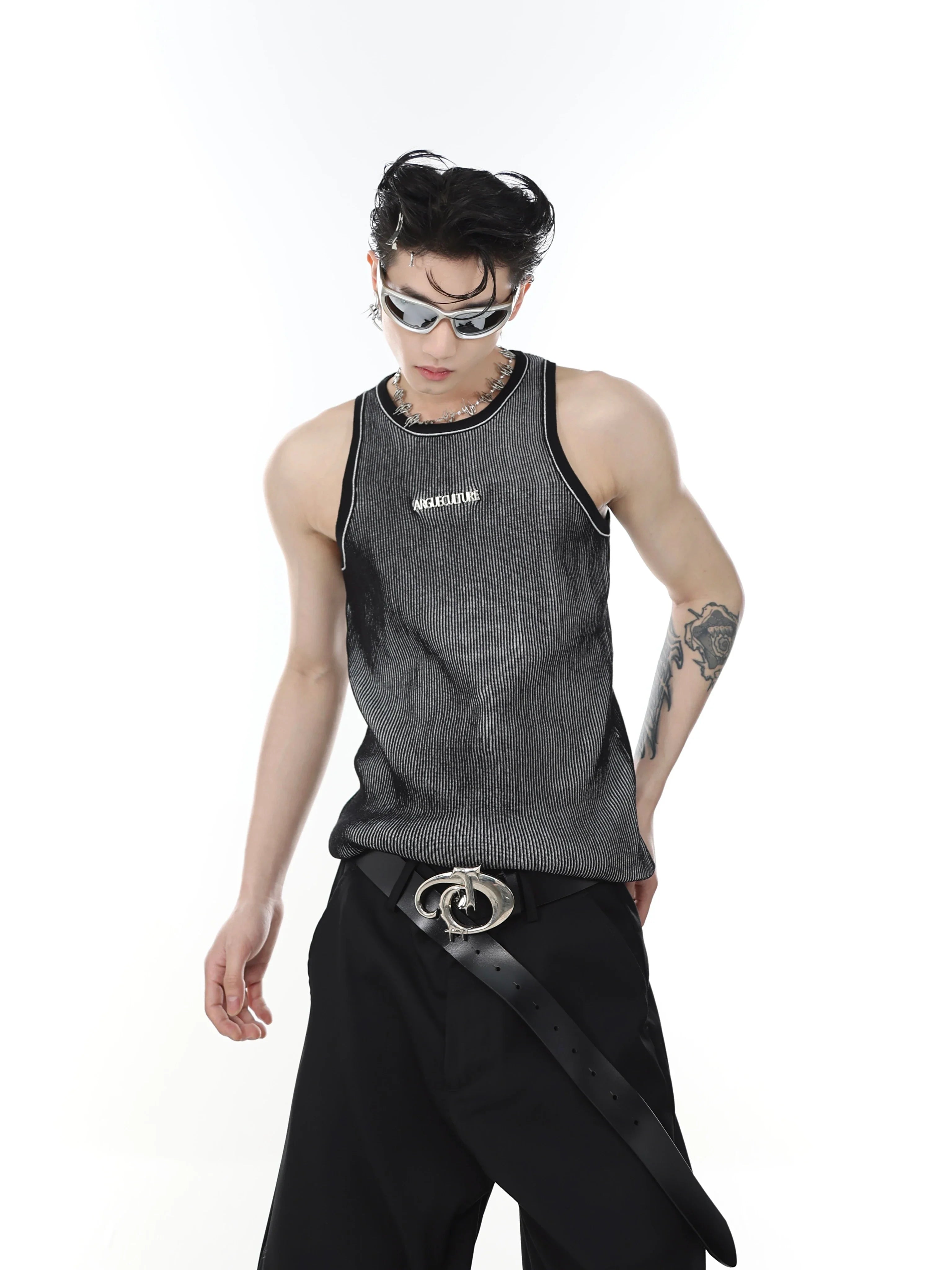 Cropped knit vest with textured stripe pattern and sleeveless design, perfect for streetwear outfits