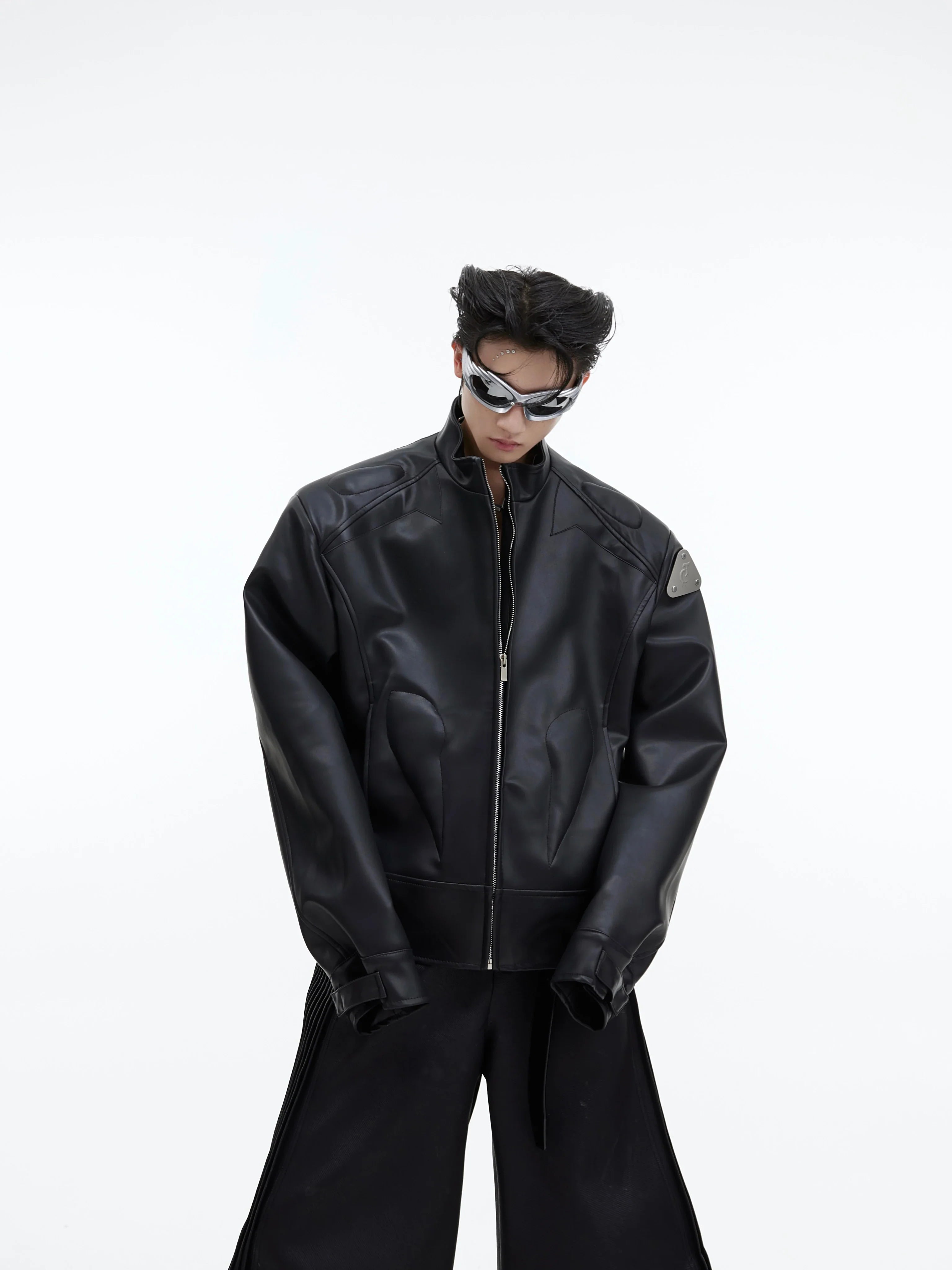 Cropped PU leather jacket with edgy 3D triangular metal accents, perfect for streetwear fashion