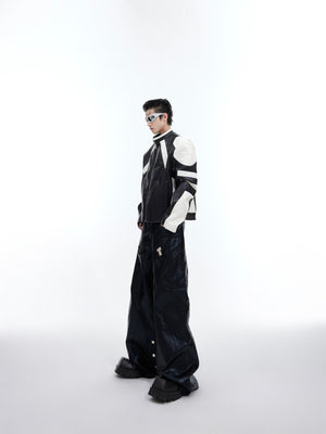 Model wearing deconstructed color-block jacket demonstrating the cropped streetwear silhouette